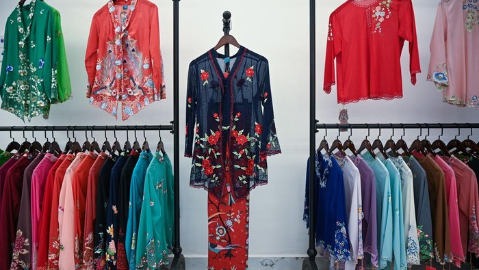 This picture taken on April 7, 2023 shows kebayas, a traditional outfit worn by women in Southeast Asia, displayed for sale at a shop in Kuala Lumpur. - Brunei, Indonesia, Malaysia, Singapore and Thailand agreed to jointly nominate the 