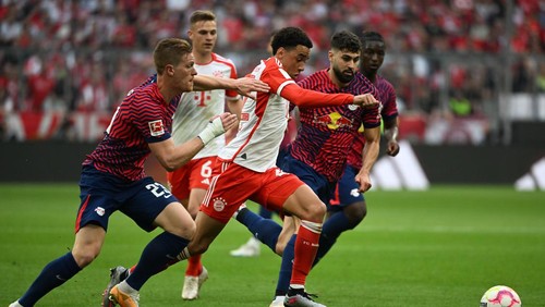 20 May 2023, Bavaria, Munich: Soccer: Bundesliga, Bayern Munich - RB Leipzig, Matchday 33, Allianz Arena. Leipzigs Marcel Halstenberg and Munichs Jamal Musiala fight for the ball. Photo: Sven Hoppe/dpa (Photo by Sven Hoppe/picture alliance via Getty Images)