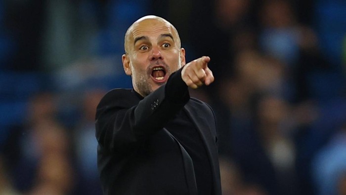 Soccer Football - Champions League - Semi Final - Second Leg - Manchester City v Real Madrid - Etihad Stadium, Manchester, Britain - May 17, 2023 Manchester City manager Pep Guardiola celebrates after the match REUTERS/Molly Darlington