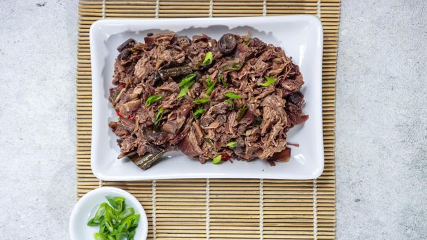 Traditional indonesian culinary food. Oseng jantung pisang or tuntut (ontong) is stir fry banana blossom, Indonesian specialties menu made from banana blossom mixed with spicy seasoning.