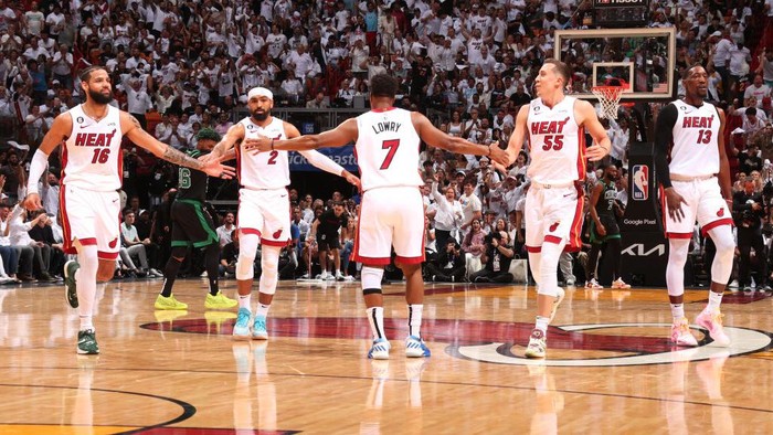 MIAMI, FL - MAY 21: Kyle Lowry #7 high fives Caleb Martin #16 and Duncan Robinson #55 of the Miami Heat during Round 3 Game 3 of the Eastern Conference Finals 2023 NBA Playoffs against the Boston Celtics on May 21, 2023 at Miami-Dade Arena in Miami, Florida. NOTE TO USER: User expressly acknowledges and agrees that, by downloading and or using this Photograph, user is consenting to the terms and conditions of the Getty Images License Agreement. Mandatory Copyright Notice: Copyright 2023 NBAE (Photo by Issac Baldizon/NBAE via Getty Images)