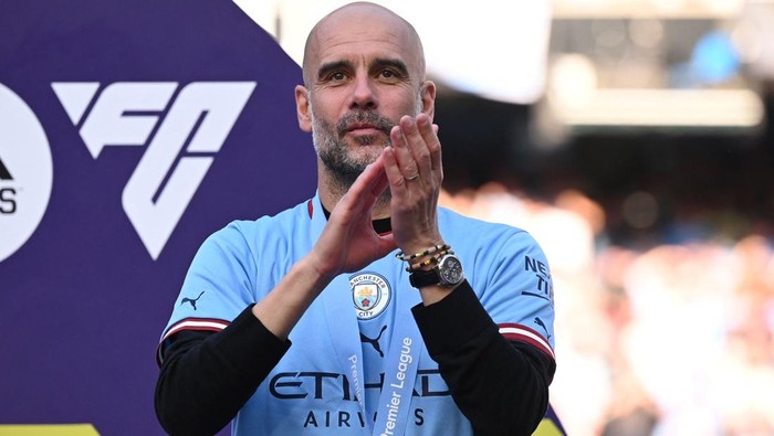 Manchester Citys Spanish manager Pep Guardiola applauds at the Premier League presentation ceremony following the English Premier League football match between Manchester City and Chelsea at the Etihad Stadium in Manchester, north west England, on May 21, 2023. Manchester City won the Premier League for the fifth time in six seasons on Saturday, taking a first step to a possible golden treble of trophies as second-placed Arsenal lost 1-0 at Nottingham Forest. (Photo by Oli SCARFF / AFP) / RESTRICTED TO EDITORIAL USE. No use with unauthorized audio, video, data, fixture lists, club/league logos or live services. Online in-match use limited to 120 images. An additional 40 images may be used in extra time. No video emulation. Social media in-match use limited to 120 images. An additional 40 images may be used in extra time. No use in betting publications, games or single club/league/player publications. /  (Photo by OLI SCARFF/AFP via Getty Images)