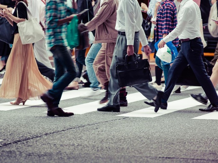 Asian People are across the crosswalk
