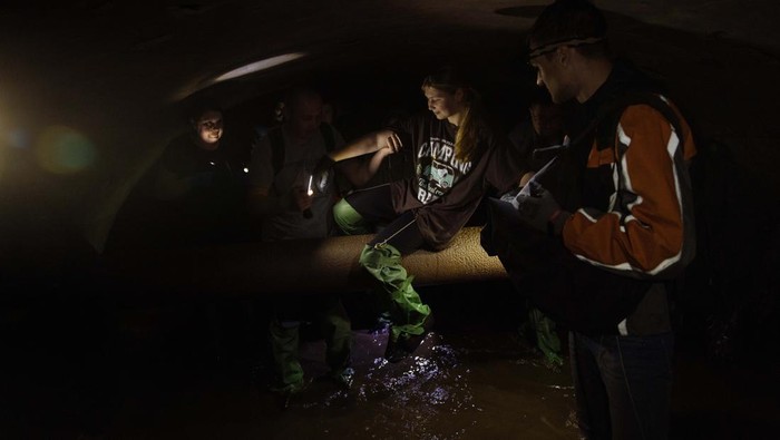 KYIV, UKRAINE - MAY 21: People walk inside a sewage collector during a tour exploring underground the main capital's street Khreschatyk, and other downtown streets, on May 21, 2023 in Kyiv, Ukraine. (Photo by Roman Pilipey/Getty Images)