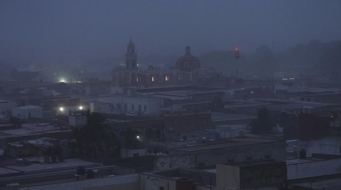 Volcanic ash from the Popocatépetl volcano covers Atlixco, Mexico, Monday, May 22, 2023. The volcano's activity has increased over the past week. Evacuations have not been ordered, but authorities are preparing for that scenario and telling people to stay out of 7.5-mile (12-kilometer) radius around the peak. (AP Photo/Marco Ugarte)