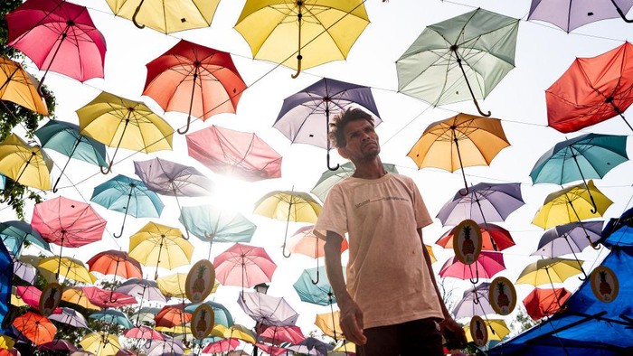 A canopy made of umbrellas to shelter from the sun in New Delhi, India, on Friday, May 19, 2023. The extreme heat that baked parts of Southeast Asia last month was largely driven by human-induced climate change, according to analysis from a team of scientists. Photographer: Anindito Mukherjee/Bloomberg via Getty Images