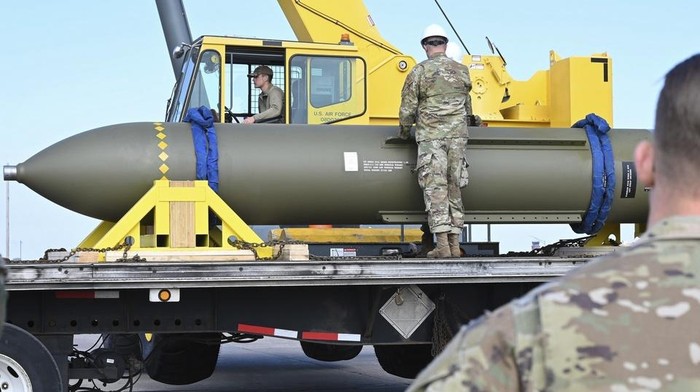 In this photo released by the U.S. Air Force on May 2, 2023, airmen look at a GBU-57, or the Massive Ordnance Penetrator bomb, at Whiteman Air Base in Missouri. That U.S. bomb, designed to destroy underground sites at the height of concerns a decade ago over Irans nuclear program, has briefly reappeared amid new tensions with the Islamic Republic. (U.S. Air Force via AP)