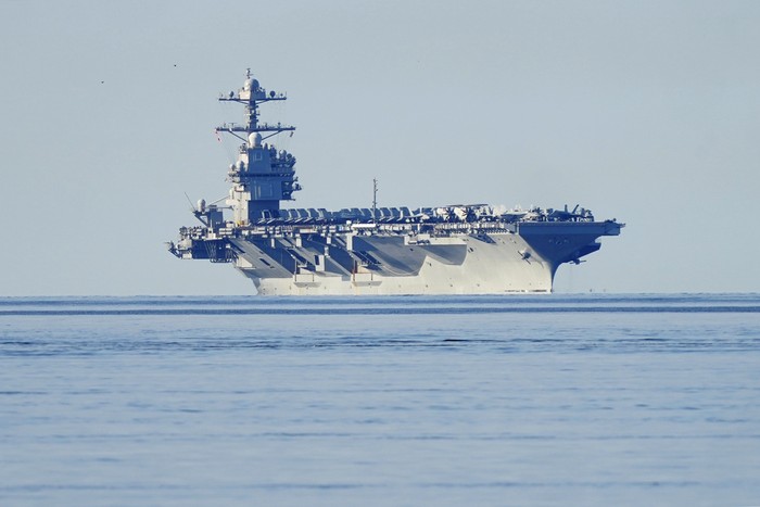 The aircraft carrier USS Gerald R. Ford passes on its way to the Oslo Fjord, at Drobak, Norway, Wednesday, May 24, 2023. The ship is the worlds largest warship and will be in port of Oslo for four days. (Terje Pedersen/NTB Scanpix via AP)