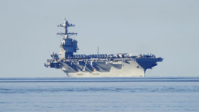 The aircraft carrier USS Gerald R. Ford passes on its way to the Oslo Fjord, at Drobak, Norway, Wednesday, May 24, 2023. The ship is the worlds largest warship and will be in port of Oslo for four days. (Terje Pedersen/NTB Scanpix via AP)