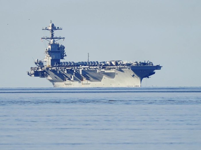 The aircraft carrier USS Gerald R. Ford passes on its way to the Oslo Fjord, at Drobak, Norway, Wednesday, May 24, 2023. The ship is the worlds largest warship and will be in port of Oslo for four days. (Terje Pedersen/NTB Scanpix via AP)