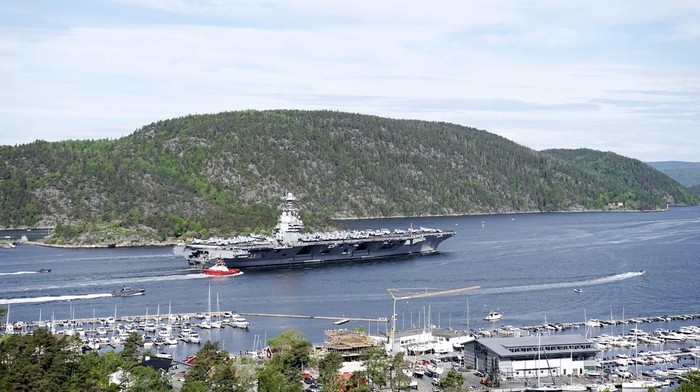 The aircraft carrier USS Gerald R. Ford passes on its way to the Oslo Fjord, at Drobak, Norway, Wednesday, May 24, 2023. The ship is the world's largest warship and will be in port of Oslo for four days. (Terje Pedersen/NTB Scanpix via AP)