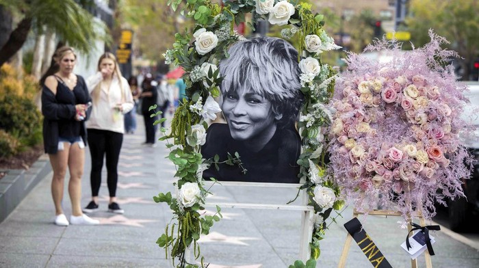 People come to see Tina Turner's Hollywood Walk of Fame Star on Wednesday, May 24, 2023 in Los Angeles. Tina Turner, the unstoppable singer and stage performer who teamed with husband Ike Turner for a dynamic run of hit records and live shows in the 1960s and ‘70s died Tuesday, May 23, 2023. (Sarah Reingewirtz/The Orange County Register via AP)
