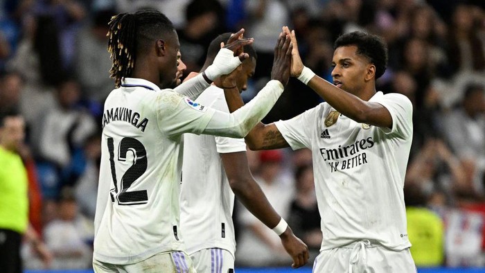 Real Madrids Brazilian forward Rodrygo celebrates with Real Madrids French midfielder Eduardo Camavinga (L) scoring his teams second goal during the Spanish league football match between Real Madrid CF and Rayo Vallecano de Madrid at the Santiago Bernabeu stadium in Madrid on May 24, 2023. (Photo by JAVIER SORIANO / AFP) (Photo by JAVIER SORIANO/AFP via Getty Images)