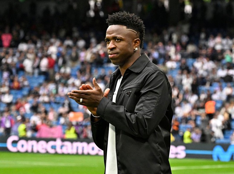 Real Madrid's Brazilian forward Vinicius Junior greets the audience prior the Spanish league football match between Real Madrid CF and Rayo Vallecano de Madrid at the Santiago Bernabeu stadium in Madrid on May 24, 2023. Vinicius drew global support after making a stand against racist abuse he received on May 21 from Valencia supporters at their Mestalla stadium. (Photo by JAVIER SORIANO / AFP) (Photo by JAVIER SORIANO/AFP via Getty Images)
