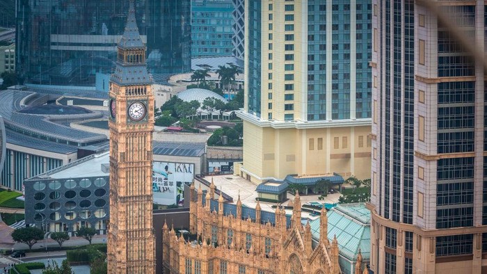 1257865054 A replica of the Big Ben at the Londoner Macao casino resort, operated by Sands China Ltd., a unit of Las Vegas Sands Corp., reflected in a window in Macau, China, on Thursday, May 25, 2023. The Londoner Macao officially opens today. Photographer: Eduardo Leal/Bloomberg via Getty Images