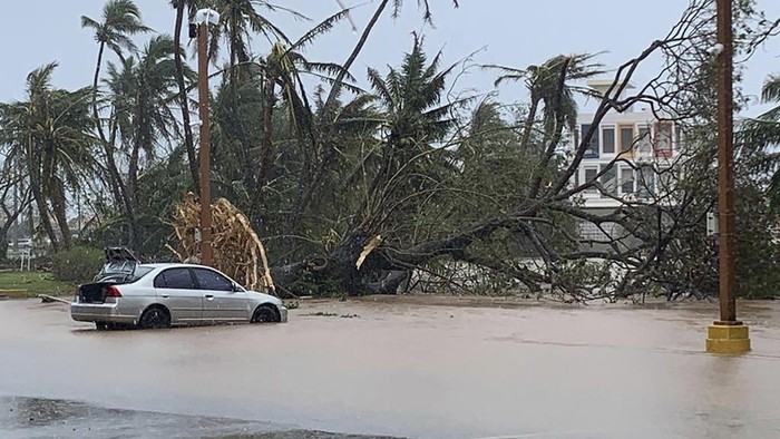 High waves from Typhoon Mawar batter the coast of Ipan in Talofofo, Guam, Wednesday, May 24, 2023. Many residents of Guam remained without power and utilities Thursday after Typhoon Mawar tore through the remote U.S. Pacific territory the night before and ripped roofs off homes, flipped vehicles and shredded trees. (Rick Cruz/The Pacific Daily via AP)