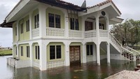 Sebuah bangunan terendam banjir di Hagatna, Guam, Kamis (25/5/2023). AP/Grace Garces Bordallo