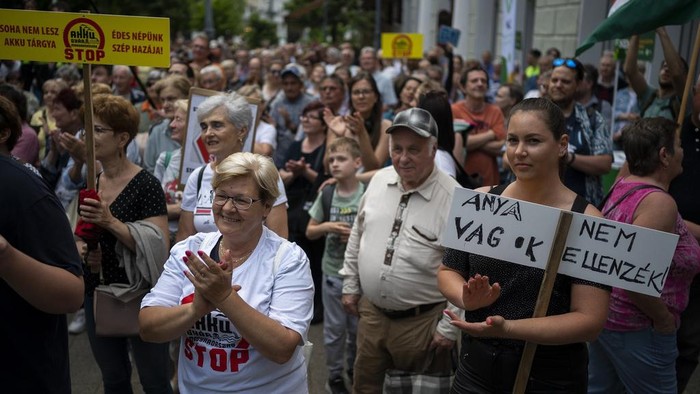 Residents gather in Debrecen, Hungary, during a demonstration against a factory that will produce batteries for electric vehicles built by a China-based company on Tuesday, May 23, 2023. Residents, environmentalists and opposition politicians are worried that a sprawling battery factory will exacerbate existing environmental problems and use up the country's precious water supplies. (AP Photo/Denes Erdos)