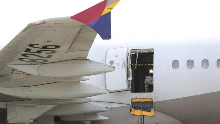An Asiana Airlines plane is parked as one of the planes doors suddenly opened at Daegu International Airport in Daegu, South Korea, Friday, May 26, 2023. A passenger opened a door on an Asiana Airlines flight that later landed safely at a South Korean airport Friday, airline and government officials said. (Yun Kwan-shick/Yonhap via AP)
