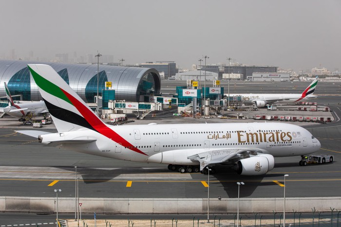 Emirates Airbus A380-800 airplane with registration A6-EEE landing at Amsterdam Schiphol AMS EHAM International Airport in a blue sky with clouds day. Emirates EK or UAE is the large airline in the Middle East and larger Airbus A380 double decker aircraft operator. Emirates connects Amsterdam with DXB OMDB Dubai International Airport daily as it is their hub. The airline is owned by the government of Dubai, United Arab Emirates. (Photo by Nicolas Economou/NurPhoto via Getty Images)