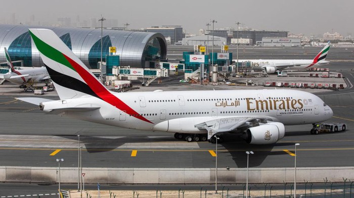 1139028801 Emirates Airbus A380-800 airplane with registration A6-EEE landing at Amsterdam Schiphol AMS EHAM International Airport in a blue sky with clouds day. Emirates EK or UAE is the large airline in the Middle East and larger Airbus A380 double decker aircraft operator. Emirates connects Amsterdam with DXB OMDB Dubai International Airport daily as it is their hub. The airline is owned by the government of Dubai, United Arab Emirates. (Photo by Nicolas Economou/NurPhoto via Getty Images)
