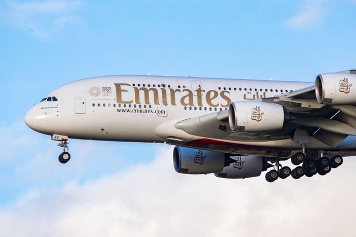 Emirates Airbus A380-800 airplane with registration A6-EEE landing at Amsterdam Schiphol AMS EHAM International Airport in a blue sky with clouds day. Emirates EK or UAE is the large airline in the Middle East and larger Airbus A380 double decker aircraft operator. Emirates connects Amsterdam with DXB OMDB Dubai International Airport daily as it is their hub. The airline is owned by the government of Dubai, United Arab Emirates. (Photo by Nicolas Economou/NurPhoto via Getty Images)