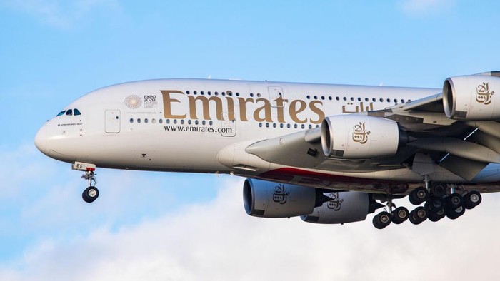 Emirates Airbus A380-800 airplane with registration A6-EEE landing at Amsterdam Schiphol AMS EHAM International Airport in a blue sky with clouds day. Emirates EK or UAE is the large airline in the Middle East and larger Airbus A380 double decker aircraft operator. Emirates connects Amsterdam with DXB OMDB Dubai International Airport daily as it is their hub. The airline is owned by the government of Dubai, United Arab Emirates. (Photo by Nicolas Economou/NurPhoto via Getty Images)