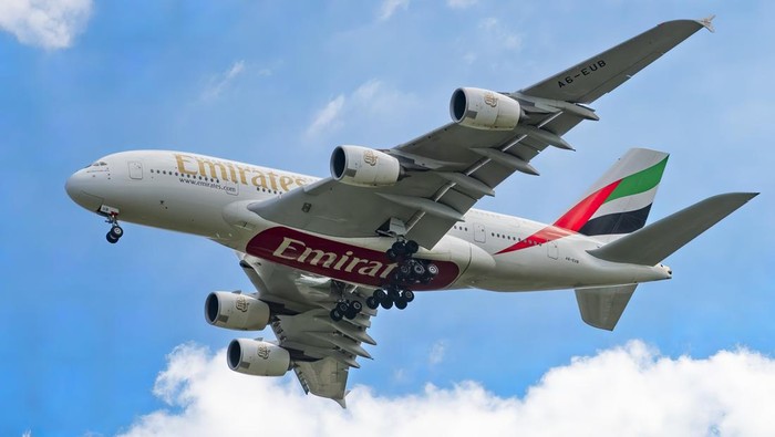 Emirates Airbus A380-800 airplane with registration A6-EEE landing at Amsterdam Schiphol AMS EHAM International Airport in a blue sky with clouds day. Emirates EK or UAE is the large airline in the Middle East and larger Airbus A380 double decker aircraft operator. Emirates connects Amsterdam with DXB OMDB Dubai International Airport daily as it is their hub. The airline is owned by the government of Dubai, United Arab Emirates. (Photo by Nicolas Economou/NurPhoto via Getty Images)