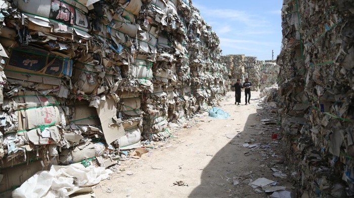 IDLIB, SYRIA - MAY 4: Child makes plates from waste paper at wasted paper recycling facilities in the areas of Sermada and Killi in northern Idlib, Syria on May 4, 2023. This facilities also contributes to reduce environmental pollution and create new jobs for people. (Photo by Kasim Rammah/Anadolu Agency via Getty Images)