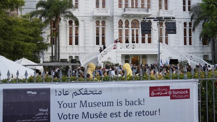 A crowd of people gather at the courtyard of the Sursock Museum during an opening event for the iconic venue in Beirut, Lebanon, Friday, May 26, 2023. The museum has reopened to the public, three years after after a deadly explosion in the nearby Beirut port reduced many of its treasured paintings and collections to ashes. (AP Photo/Hussein Malla)