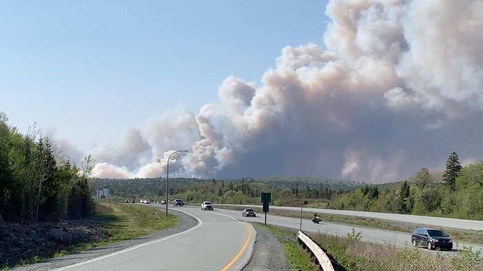 Large plumes of smoke rise from a wildfire raging in the Upper Tantallon area, as seen from Hubley, Nova Scotia, Canada May 28, 2023 in this screen grab obtained from a social media video. Ben Britton/via REUTERS  THIS IMAGE HAS BEEN SUPPLIED BY A THIRD PARTY. MANDATORY CREDIT. NO RESALES. NO ARCHIVES.