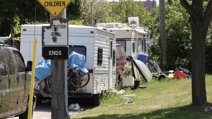 TORONTO, ON - May 29  With the current housing crunch and economic problems, some people have taken to living in their car or in campers.  A series of trailers and campers have been parked for  months on Bouchette near the Logan and Lakeshore intersection.
May 29 2023        (Richard Lautens/Toronto Star via Getty Images)