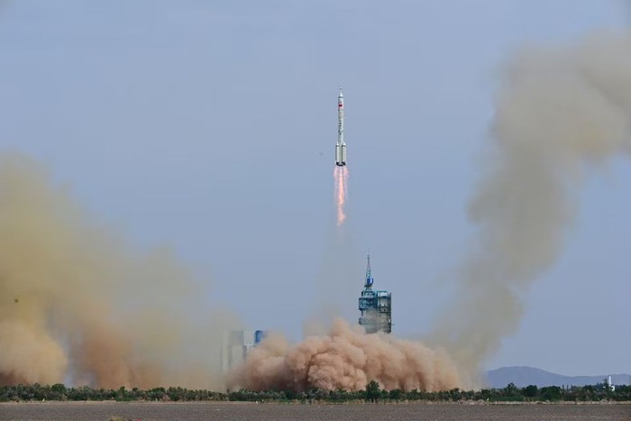 A Long March-2F carrier rocket, carrying the Shenzhou-16 spacecraft and three astronauts, takes off from the launching area of Jiuquan Satellite Launch Center for a crewed mission to Chinas Tiangong space station, near Jiuquan, Gansu province, China May 30, 2023. China Daily via REUTERS