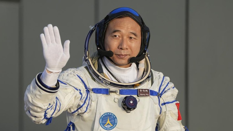 Jing Haipeng, mission commander for the Shenzhou-16 mission waves during a send-off ceremony for his manned space mission at the Jiuquan Satellite Launch Center in northwestern China, Tuesday, May 30, 2023. (AP Photo/Mark Schiefelbein)