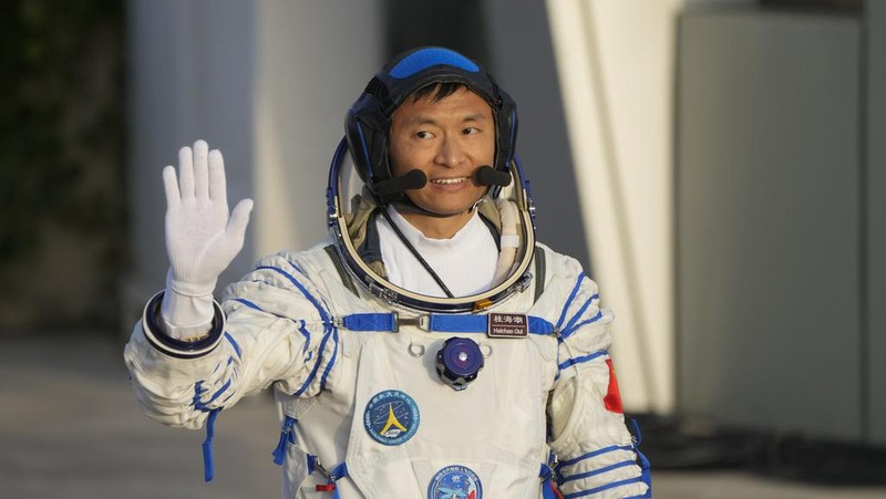 Chinese astronaut Gui Haichao waves during a send-off ceremony for his manned space mission at the Jiuquan Satellite Launch Center in northwestern China, Tuesday, May 30, 2023. (AP Photo/Mark Schiefelbein)