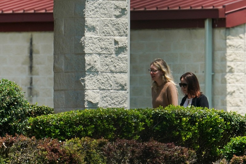 Theranos founder Elizabeth Holmes arrives to begin serving her prison sentence for defrauding investors in the failed blood-testing startup, at the Federal Prison Camp in Bryan, Texas, U.S. May 30, 2023.  REUTERS/Go Nakamura