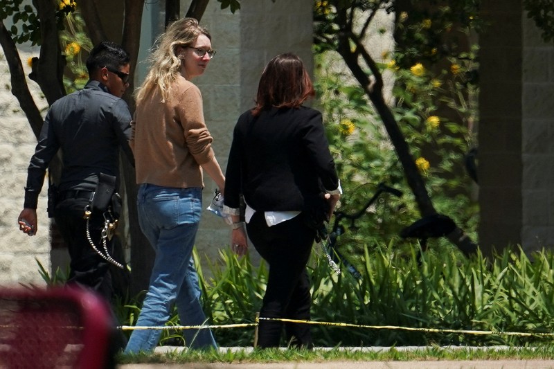 Theranos founder Elizabeth Holmes arrives to begin serving her prison sentence for defrauding investors in the failed blood-testing startup, at the Federal Prison Camp in Bryan, Texas, U.S. May 30, 2023.  REUTERS/Go Nakamura
