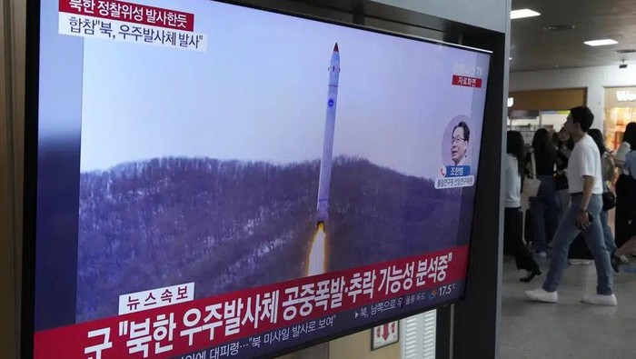 A TV screen shows a file image of North Koreas rocket launch during a news program at the Seoul Railway Station in Seoul, South Korea, Wednesday, May 31, 2023. North Korea launched a purported rocket Wednesday, a day after the country announced a plan to put its first military spy satellite into orbit, South Koreas military said. (AP Photo/Ahn Young-joon)