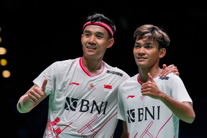 BIRMINGHAM, ENGLAND - MARCH 14: Muhammad Shohibul Fikri (R) and Bagas Maulana of Indonesia celebrate the victory in the Mens Doubles first round match against Kim Gi Jung and Kim Sa Rang of Korea on day one of the Yonex All England Badminton Championships at Utilita Arena Birmingham on March 14, 2023 in Birmingham, England. (Photo by Shi Tang/Getty Images)
