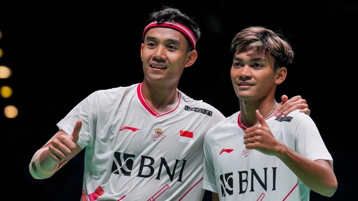 BIRMINGHAM, ENGLAND - MARCH 14: Muhammad Shohibul Fikri (R) and Bagas Maulana of Indonesia celebrate the victory in the Mens Doubles first round match against Kim Gi Jung and Kim Sa Rang of Korea on day one of the Yonex All England Badminton Championships at Utilita Arena Birmingham on March 14, 2023 in Birmingham, England. (Photo by Shi Tang/Getty Images)
