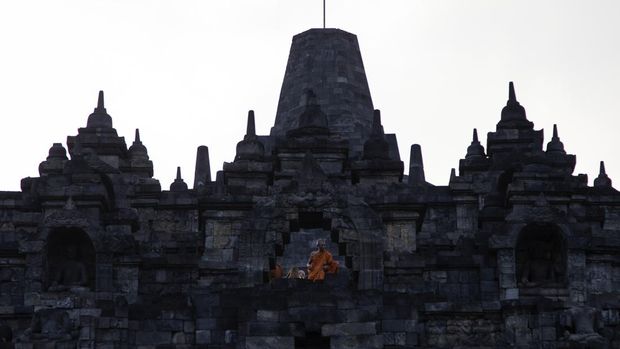 Buddhist monks descended from the Borobudur temple after performing Pradaksina at Borobudur temple in Magelang, Central Java, on June 1, 2023. 32 buddhist monks from Thailand, Malaysia and Indonesia who made a religious journey of more than 2,000 Km (International Thuddong), from Thailand to Indonesia, finished their journey at Borobudur Temple, to further celebrate Vesak Day on June 4. (Photo by Aditya Irawan/NurPhoto via Getty Images)