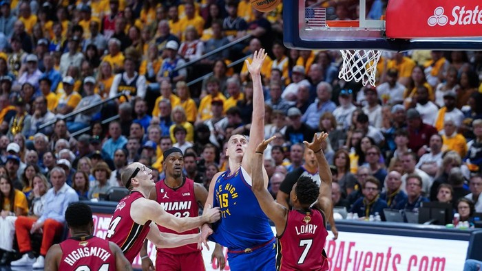 Denver Nuggets center Nikola Jokic (15) shoots over Miami Heat guard Kyle Lowry (7) during the second half of Game 1 of basketballs NBA Finals, Thursday, June 1, 2023, in Denver. (AP Photo/Jack Dempsey)