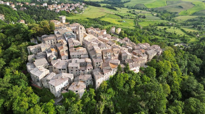 An aerial view of San Casciano dei Bagni, a hilltop village in southern Tuscany still home to popular thermal baths, where around 20 Etruscan and Roman bronze statues were discovered, in San Casciano dei Bagni, Italy, May 29, 2023. REUTERS/Guglielmo Mangiapane