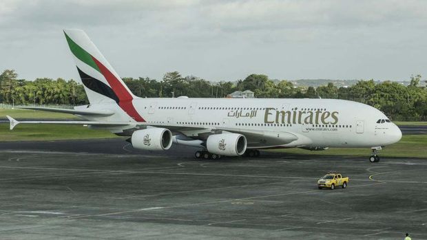 BALI, INDONESIA - JUNE 01: Airbus A380-800 operated by Emirates Airlines parked is seen after landing as airplane takes off in the back at Ngurah Rai International Airport in Kuta, Bali, Indonesia on June 1, 2023. The biggest passengers plane in the world which carries 460 passengers landed for the first time in Indonesia as part of to boost tourism industries in Bali and increase the international connectivity after pandemic era. The airplane will be used regularly for Denpasar-Dubai flight. (Photo by Johannes P. Christo/Anadolu Agency via Getty Images)
