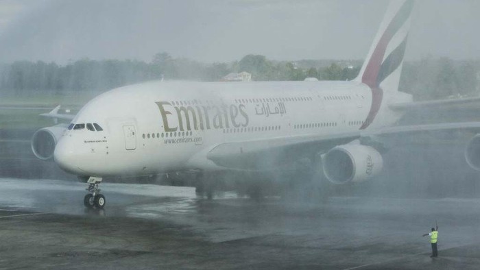 BALI, INDONESIA - JUNE 01: Airbus A380-800 operated by Emirates Airlines parked is seen after landing as airplane takes off in the back at Ngurah Rai International Airport in Kuta, Bali, Indonesia on June 1, 2023. The biggest passengers plane in the world which carries 460 passengers landed for the first time in Indonesia as part of to boost tourism industries in Bali and increase the international connectivity after pandemic era. The airplane will be used regularly for Denpasar-Dubai flight. (Photo by Johannes P. Christo/Anadolu Agency via Getty Images)