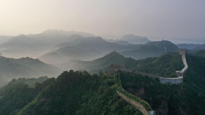 1494990972 CHENGDE, CHINA - JUNE 01: Aerial view of Jinshanling section of the Great Wall shrouded in morning mist on June 1, 2023 in Luanping County, Chengde City, Hebei Province of China. (Photo by VCG/VCG via Getty Images)