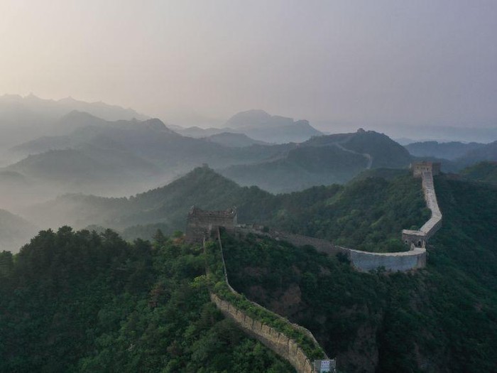CHENGDE, CHINA - JUNE 01: Aerial view of Jinshanling section of the Great Wall shrouded in morning mist on June 1, 2023 in Luanping County, Chengde City, Hebei Province of China. (Photo by VCG/VCG via Getty Images)