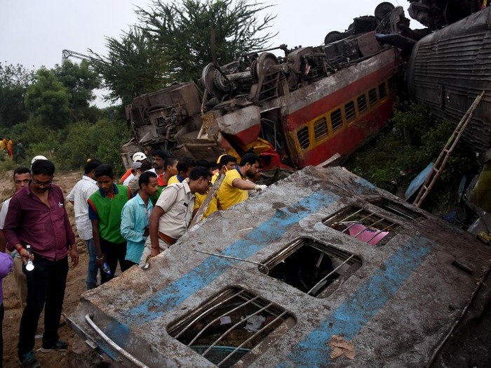 Rescue workers work atop mangled train carriages, following a deadly collision of two trains, in Balasore, India June 3, 2023, in this still image obtained from a video. ANI/Reuters TV via REUTERS THIS IMAGE HAS BEEN SUPPLIED BY A THIRD PARTY. NO RESALES. NO ARCHIVES INDIA OUT. NO COMMERCIAL OR EDITORIAL SALES IN INDIA