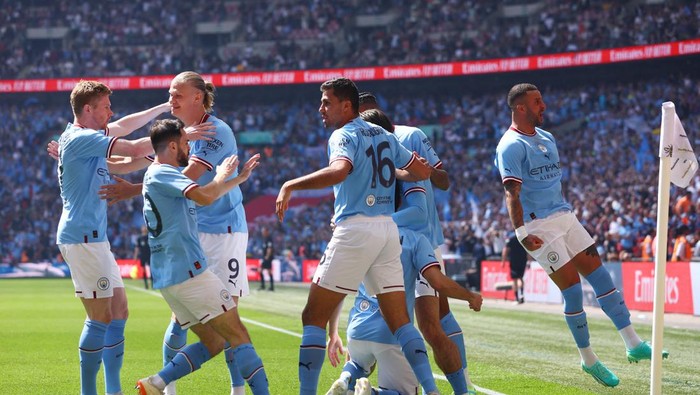 Soccer Football - FA Cup Final - Manchester City v Manchester United - Wembley Stadium, London, Britain - June 3, 2023 Manchester Citys Ilkay Gundogan celebrates scoring their first goal with Rodri, Kyle Walker and teammates Action Images via Reuters/Paul Childs