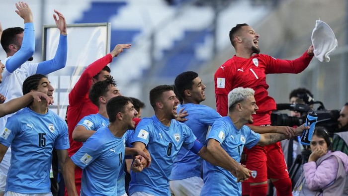 Israel players celebrate their teams 3-2 victory over Brazil at the end of a FIFA U-20 World Cup quarterfinal soccer match,  at the Bicentenario stadium in San Juan, Argentina, Saturday, June 3, 2023. (AP Photo/Natacha Pisarenko)